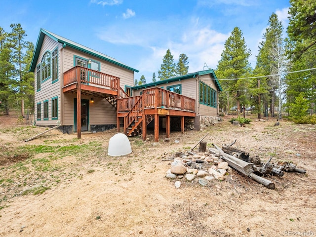 48 Warren Rd, Black Hawk, CO 80422 - back of property featuring a deck and stairs