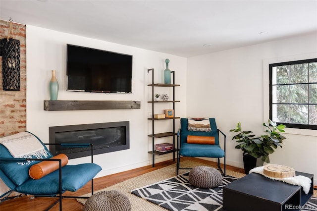 living area with hardwood / wood-style flooring