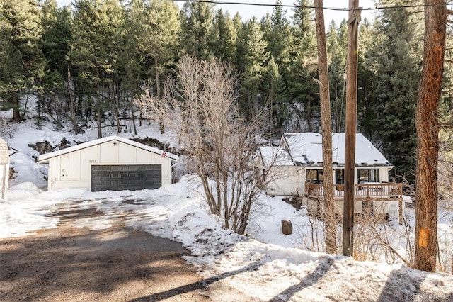 exterior space featuring a garage and a deck