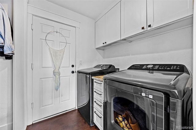 laundry room with cabinet space and washer and dryer