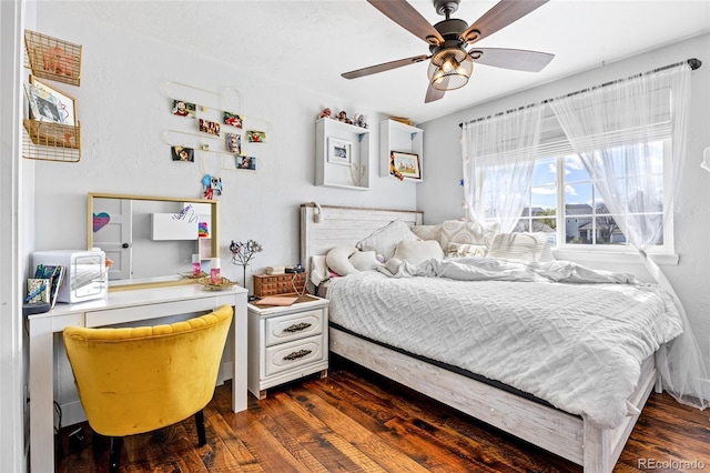 bedroom featuring dark wood finished floors and ceiling fan