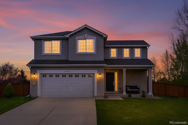 21005 Glacier Park Cv, Parker, CO 80138 - traditional-style house featuring covered porch, concrete driveway, stucco siding, and a garage