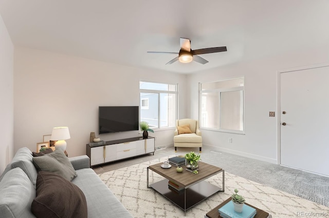 living room with light colored carpet and ceiling fan