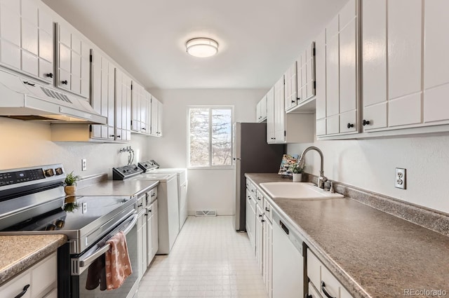 kitchen with white cabinetry, stainless steel appliances, washer and clothes dryer, and sink