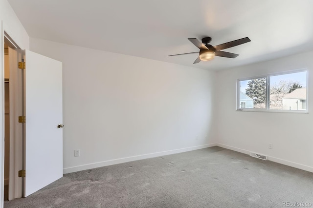 unfurnished room with carpet floors and ceiling fan