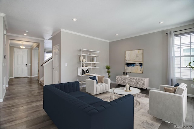 living room with ornamental molding and hardwood / wood-style floors