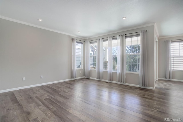 unfurnished room featuring hardwood / wood-style flooring and crown molding