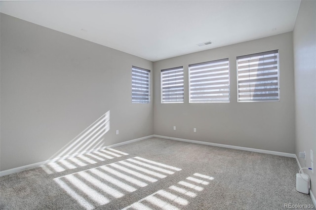 empty room featuring light colored carpet