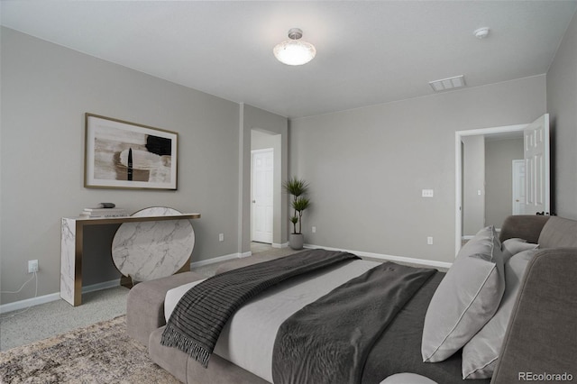 bedroom with light colored carpet