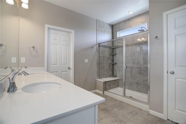 bathroom with vanity, an enclosed shower, and tile patterned floors