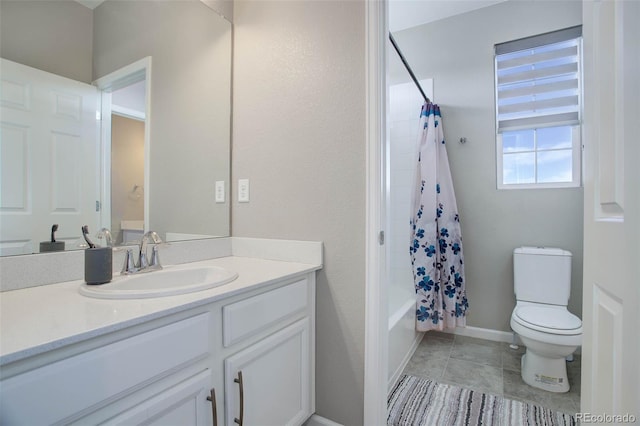 full bathroom featuring tile patterned flooring, vanity, toilet, and shower / bath combo with shower curtain