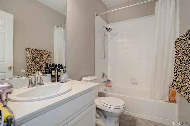 full bathroom featuring vanity, tile patterned flooring, toilet, and shower / bath combo with shower curtain