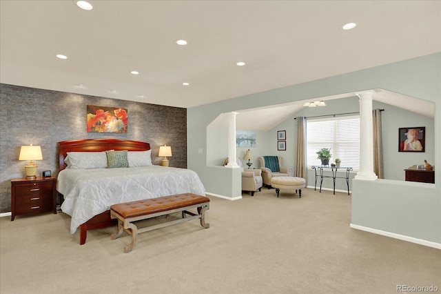 bedroom with an accent wall, baseboards, decorative columns, light carpet, and recessed lighting