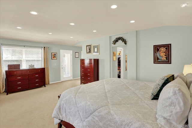 bedroom featuring a walk in closet, baseboards, lofted ceiling, carpet floors, and recessed lighting