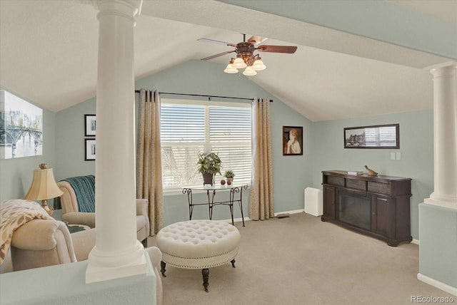 living area featuring a ceiling fan, lofted ceiling, carpet, and decorative columns