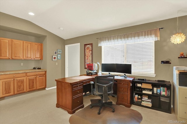 office space featuring lofted ceiling and light carpet