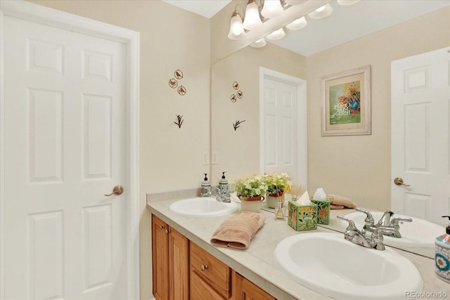 bathroom featuring double vanity and a sink