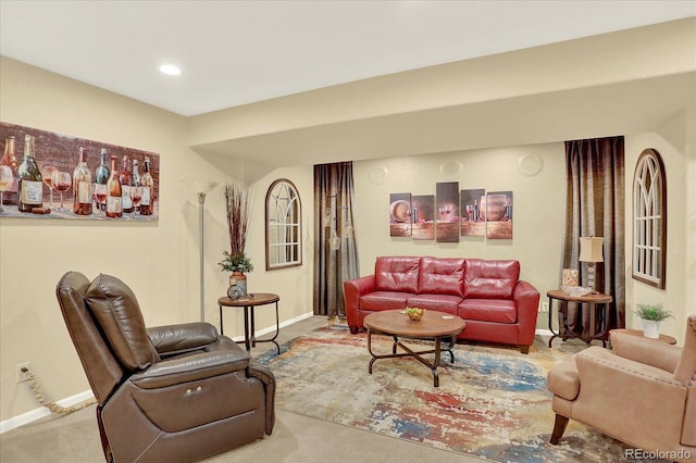 carpeted living room with recessed lighting and baseboards