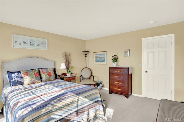 bedroom featuring carpet and baseboards