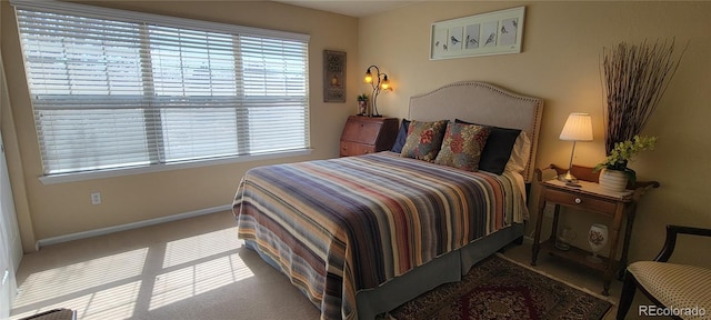 carpeted bedroom featuring visible vents and baseboards