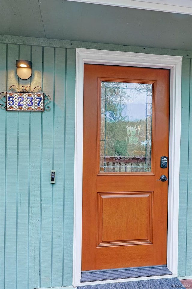 5237 S Olive Rd, Evergreen, CO 80439 - entrance to property featuring board and batten siding