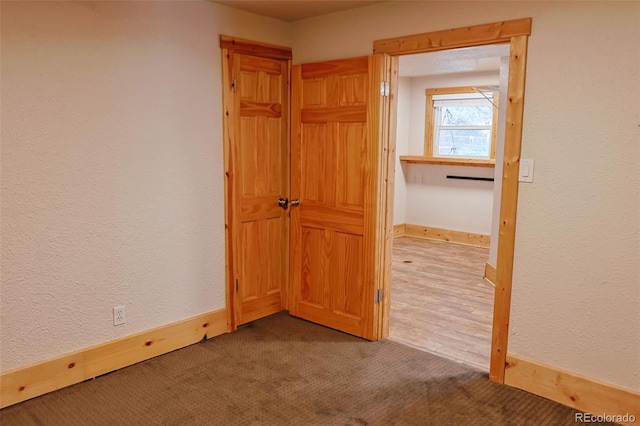 5237 S Olive Rd, Evergreen, CO 80439 - carpeted spare room with a textured wall and baseboards