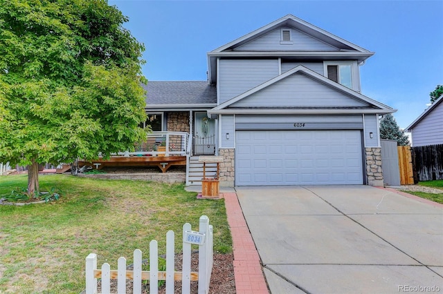 6034 S Parfet St, Littleton, CO 80127 - view of front of home featuring stone siding, driveway, a garage, and a shingled roof