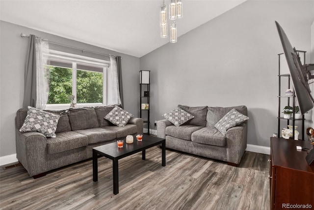 6034 S Parfet St, Littleton, CO 80127 - living area featuring lofted ceiling and wood finished floors