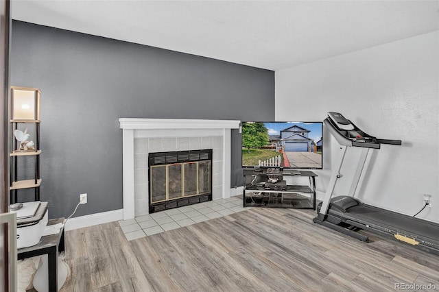 6034 S Parfet St, Littleton, CO 80127 - workout area with wood finished floors and a tile fireplace