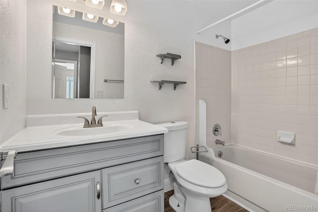 6034 S Parfet St, Littleton, CO 80127 - bathroom with vanity, bathtub / shower combination, and a textured wall