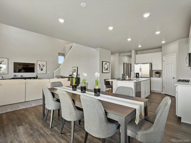 dining space featuring dark hardwood / wood-style floors