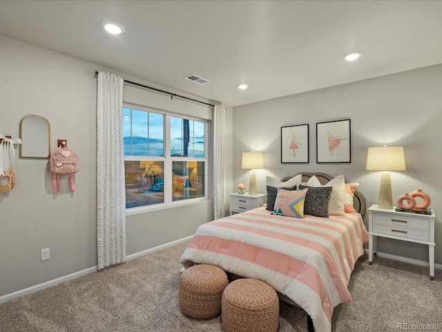 bedroom featuring light carpet