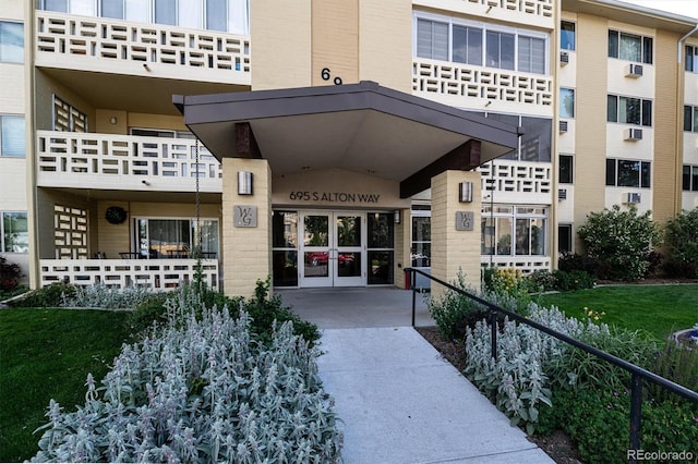 695 S Alton Way Unit 5A, Denver, CO 80247 - view of exterior entry with french doors and brick siding