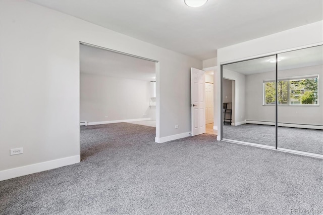 695 S Alton Way Unit 5A, Denver, CO 80247 - unfurnished bedroom featuring carpet, a baseboard radiator, a baseboard heating unit, and a closet