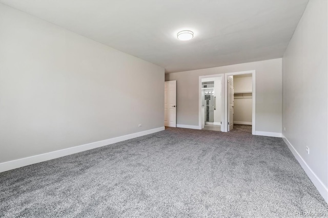 695 S Alton Way Unit 5A, Denver, CO 80247 - unfurnished bedroom with carpet flooring, a spacious closet, and a closet
