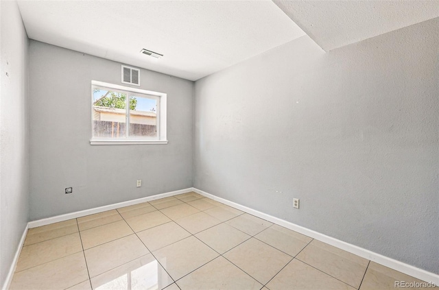 5202 Dillon St, Denver, CO 80239 - empty room featuring light tile patterned flooring and baseboards