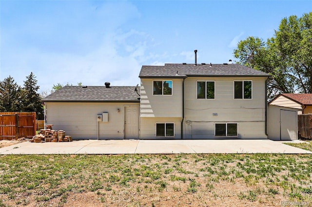 5202 Dillon St, Denver, CO 80239 - back of house with a patio, fence, and roof with shingles