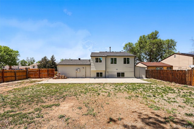 5202 Dillon St, Denver, CO 80239 - rear view of property featuring a patio