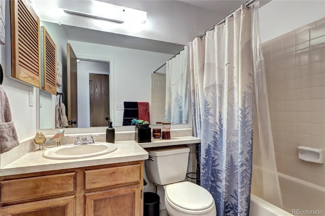 full bathroom with vanity, toilet, and shower / tub combo