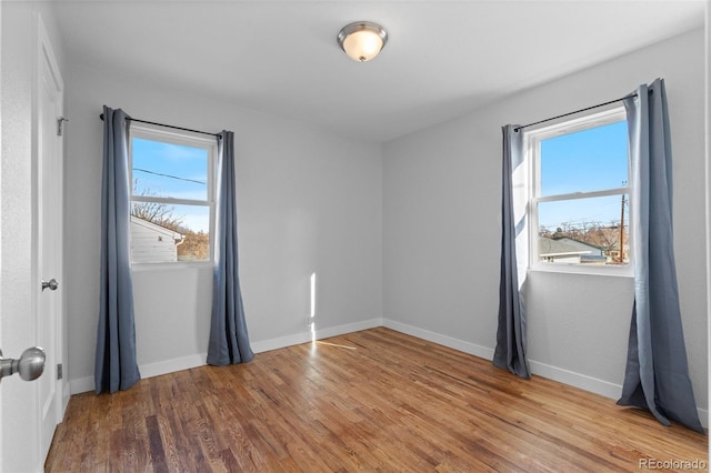 unfurnished room featuring wood-type flooring