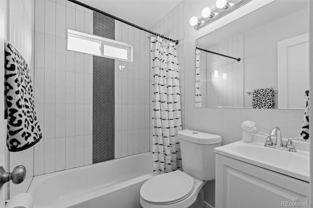 full bathroom featuring toilet, vanity, and shower / bathtub combination with curtain