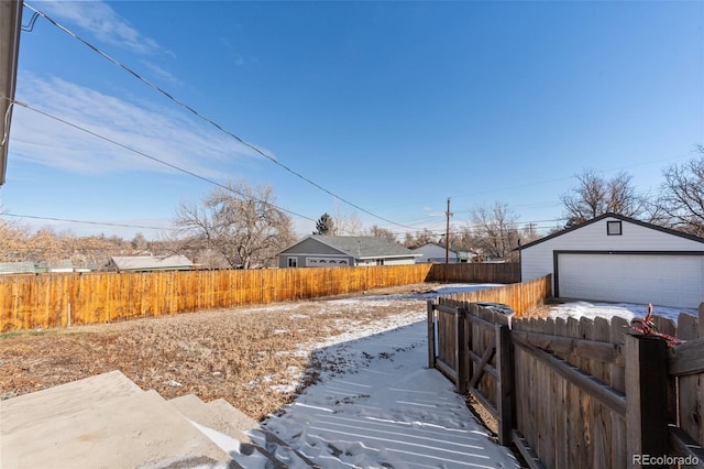 view of yard with a garage and an outdoor structure