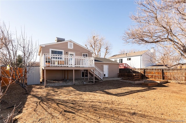 rear view of property with a deck