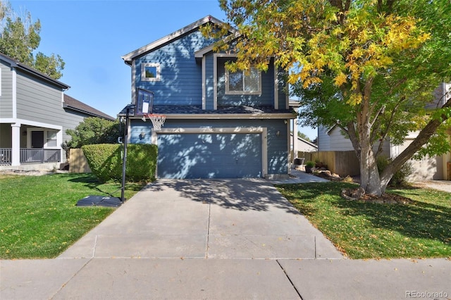 view of front of house with a front yard and a garage