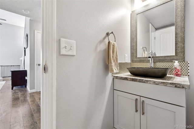 bathroom featuring hardwood / wood-style floors and vanity