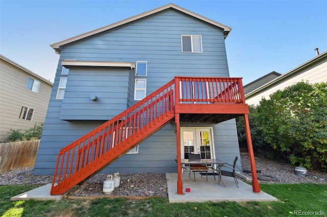 back of house with a deck, a patio, and french doors