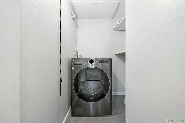 washroom with washer / dryer