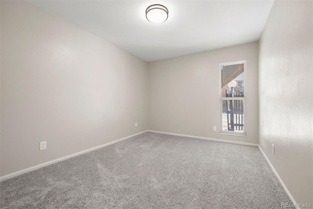 3663 S Sheridan Blvd Unit 2, Denver, CO 80235 - carpeted empty room featuring baseboards