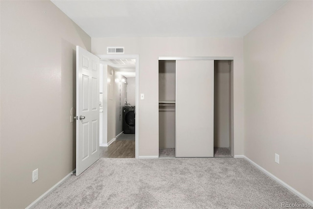 3663 S Sheridan Blvd Unit 2, Denver, CO 80235 - unfurnished bedroom featuring washer / dryer, carpet, a closet, and baseboards