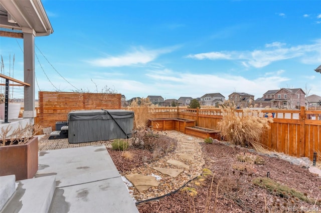 view of yard featuring a patio area and a hot tub